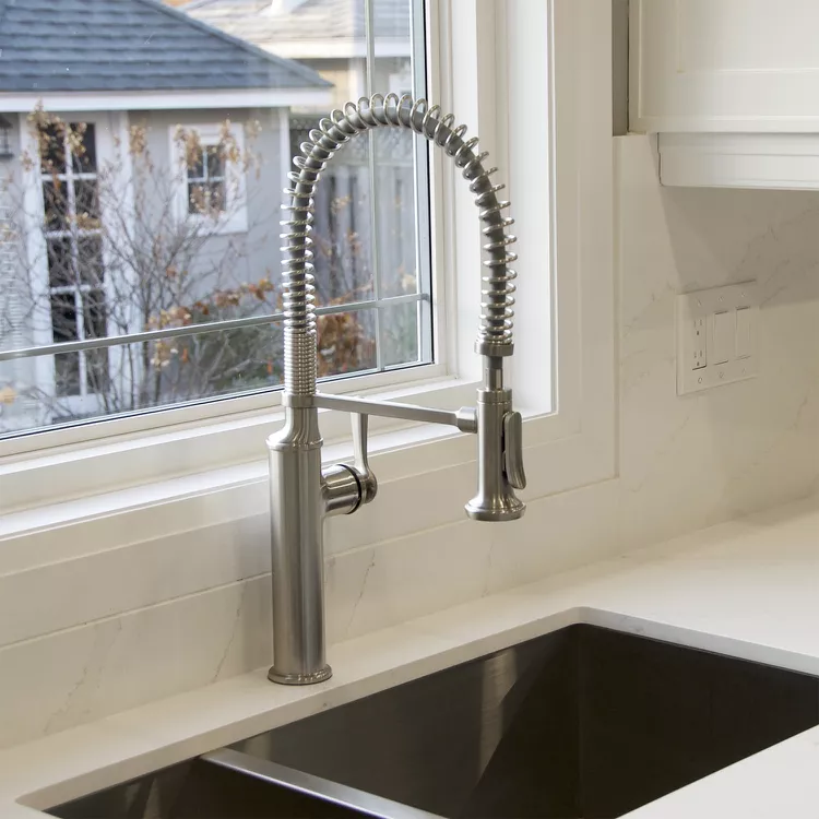 Kitchen sink with kohler faucet and window faucet