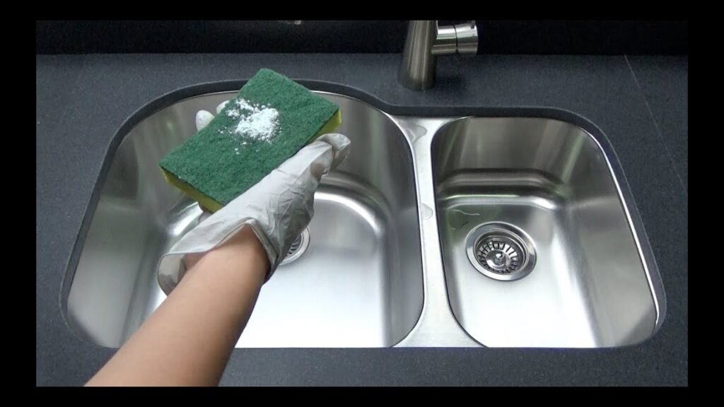 cleaning the kitchen sink with the help of  baking soda: cleaning tips for stainless steel sinks